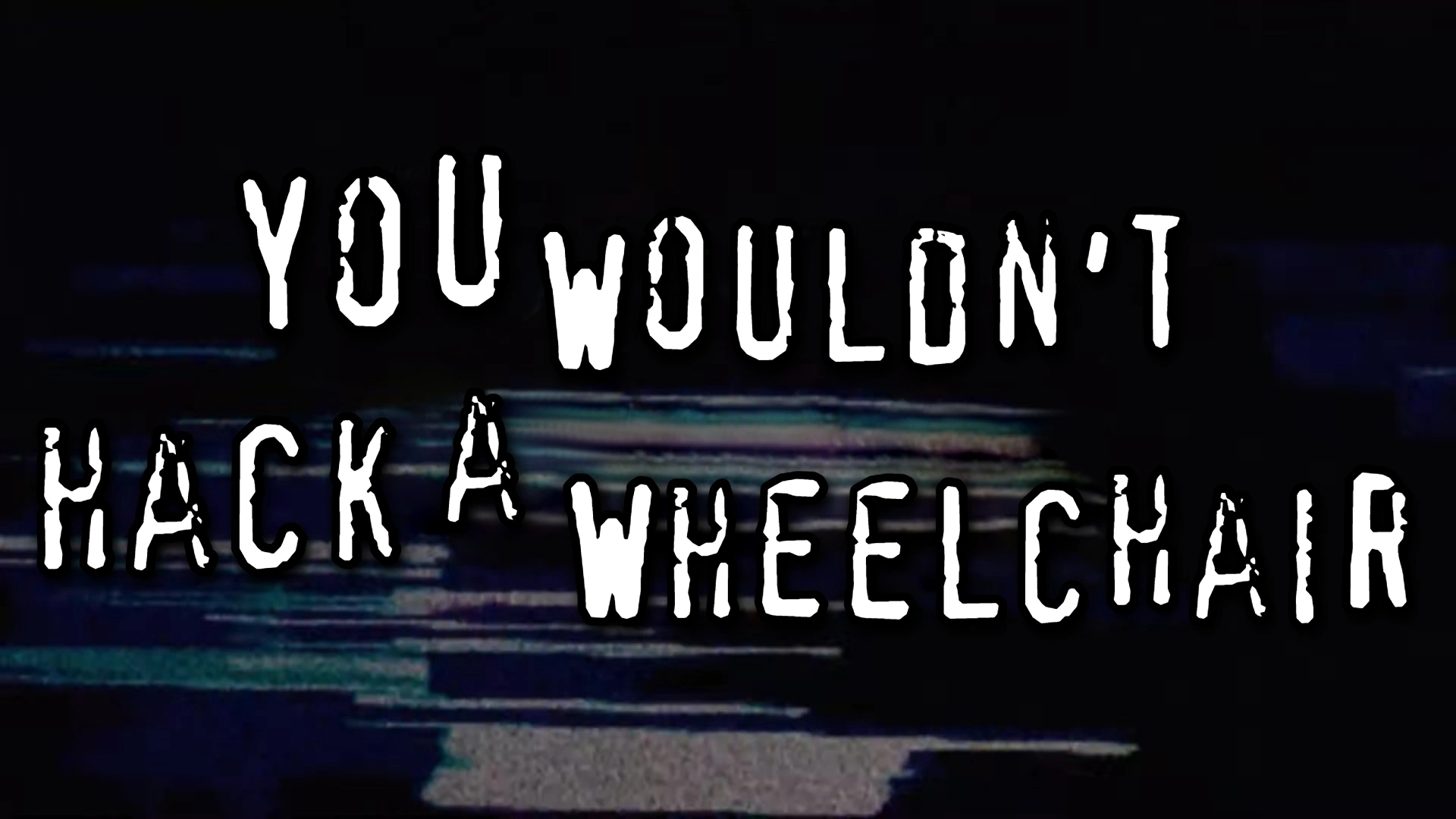 Texto en letras blancas irregulares sobre fondo oscuro con interferencias: &laquo;You wouldn&rsquo;t hack a wheelchair?&raquo; (&laquo;&iquest;No piratear&iacute;as una silla de ruedas?&raquo;).